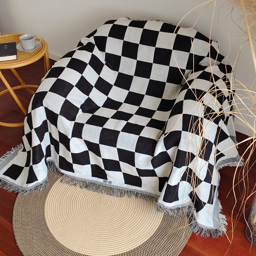 Housse de canapé à carreaux avec franges et couleurs contrastées